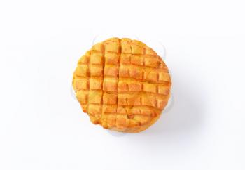 Small spiced savory biscuit on white background