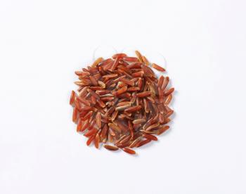 Heap of Camargue red rice (Grown organically in the wetlands of Southern France)