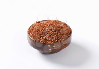 Bowl of uncooked red rice