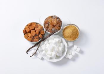 Still life of various types of sugar in bowls