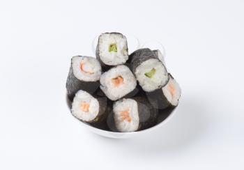 Maki sushi rolls with salmon, crab and cucumber inside