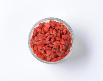 Dried goji berries in small glass bowl
