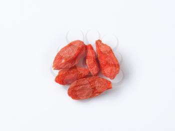 Dried goji berries on white background