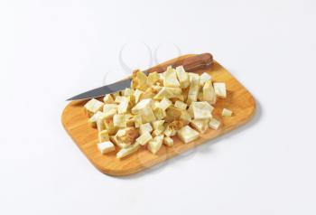 Diced celery root on cutting board