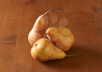 European pears with elongated slender neck and russeted skin