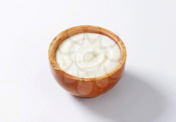 Plain semolina porridge in wooden bowl