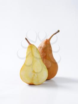 Ripe Bosc pear - whole and a half