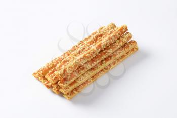 Puff-pastry strips with cheese topping