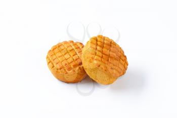 Small spiced savory biscuits on white background