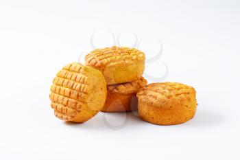 Small spiced savory biscuits on white background