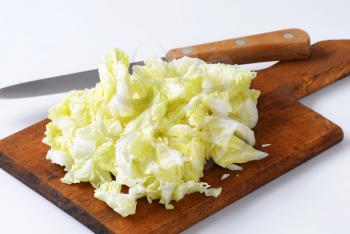Chopped napa cabbage on cutting board