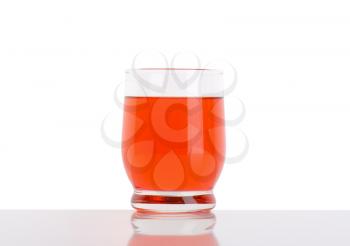 glass of strawberry juice on white background