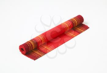 Red cotton ribbed placemat with decorative pattern