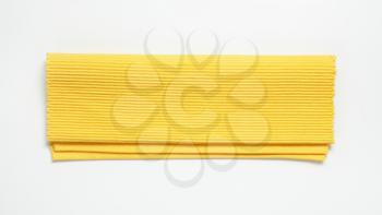 Folded yellow ribbed cotton placemat