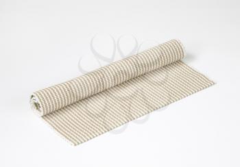 Rolled woven cotton table mat