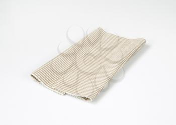 Folded woven cotton table mat