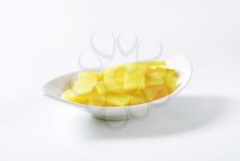 bowl of sliced bamboo shoots on white background