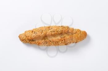 fresh bread roll with seeds on white background