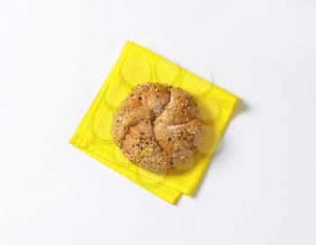 fresh bread bun on yellow place mat