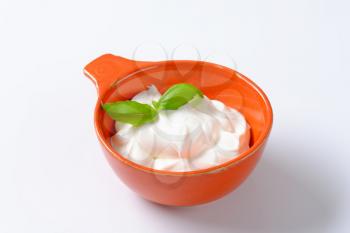 creme fraiche in an orange bowl