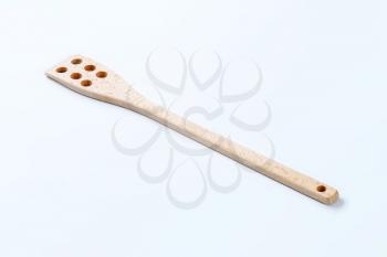 wooden spatula with six holes