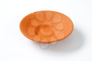 Terracotta bowl on white background