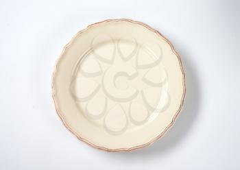 cream dinner plate with decorative edge