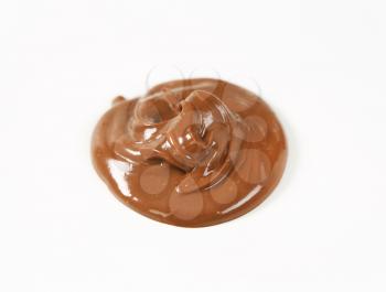 blob of chocolate spread on white background