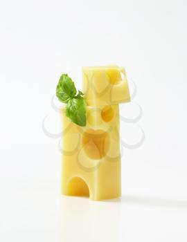 pieces of emmental cheese on white background