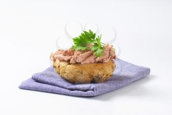 Bulkie roll with pate on blue fabric napkin