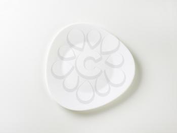 Triangle white plate with rounded edges and wide rim