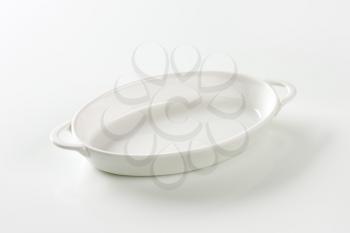 Oval white ceramic dish with handles