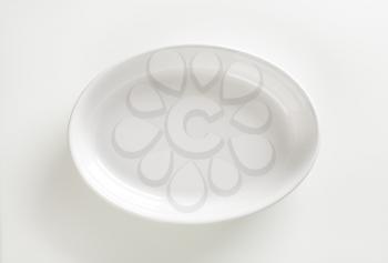 Empty deep oval porcelain dish