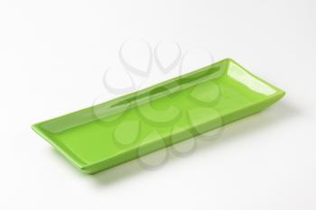 Long rectangular green ceramic serving platter