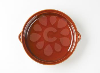 Empty round ceramic baking dish