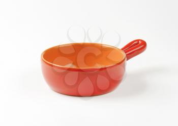 Empty glazed terracotta sauce pan