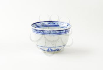 small Chinese tea cup on white background