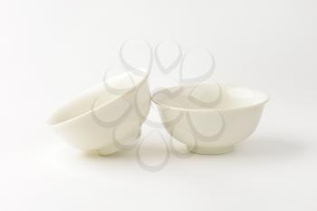 two empty deep white bowls