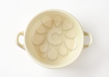 Beige ceramic soup bowl with two handles