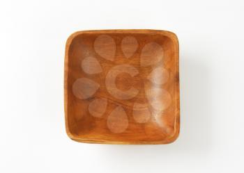 Empty small square wooden bowl