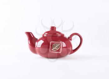 red tea pot on white background
