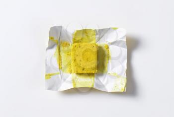 cube of dehydrated chicken-based bouillon
