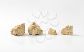 Pieces of compressed fresh yeast