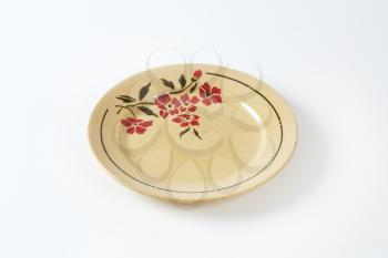 Beige dinner plate with floral design