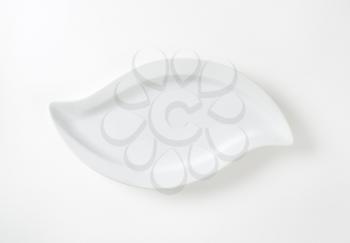 S-shape white porcelain plate with rim