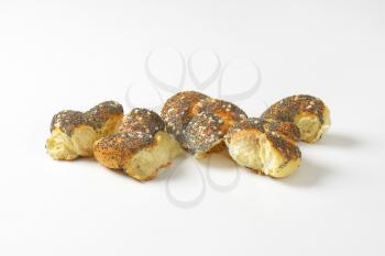 Pieces of braided poppy seed bread roll