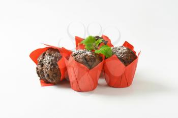 Double chocolate cupcakes wrapped in red paper