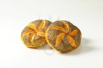 two fresh poppy seed buns on white background