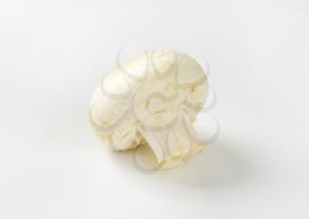 Single unpeeled white button mushroom
