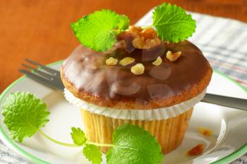 Walnut muffin topped with chocolate glaze